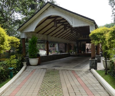 https://imgcld.yatra.com/ytimages/image/upload/t_hotel_yatra_city_desktop/v1419576083/Domestic Hotels/Hotels_Coorg/The Windflower Resorts and Spa/Main_View.jpg